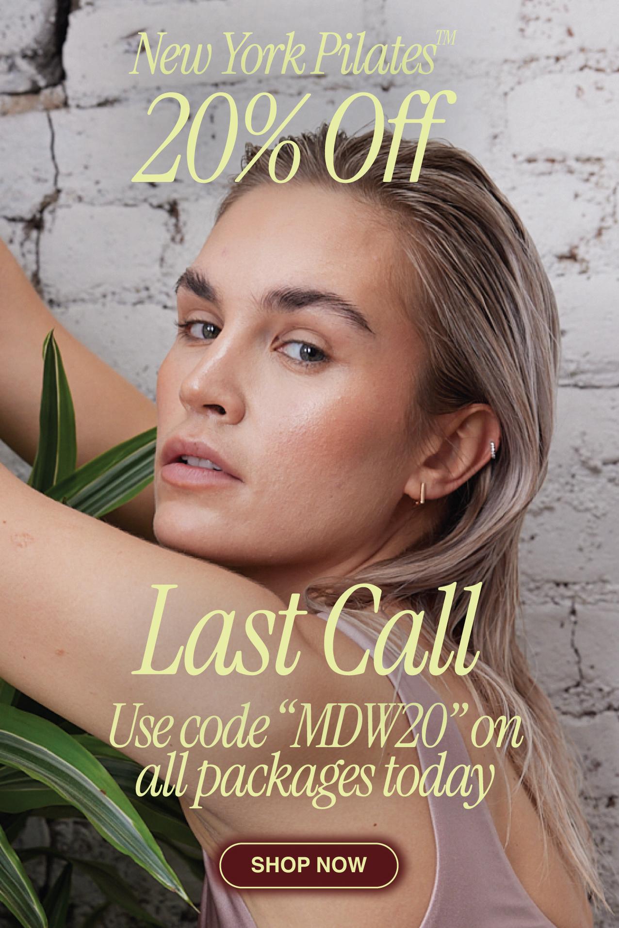 A woman with wet, slicked-back hair poses by a white brick wall with green leaves. Text reads: New York Pilates 20% Off. Last Call—shop now for the Best Pilates Pricing NYC! Use code MDW20 on all packages today.